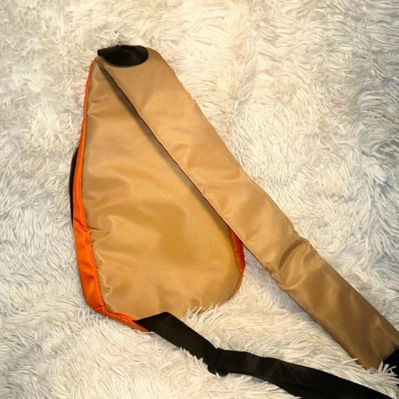 Orange body cross bag with a gold zippers. NEVER WORN - Picture 3 of 4